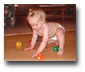 Baby playing on heated hardwood floor.