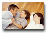 Family lying on heated hardwood floor.