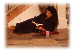 Woman reading on warm floor