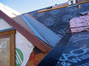 Preparing to install a low-voltage roof heating system.
